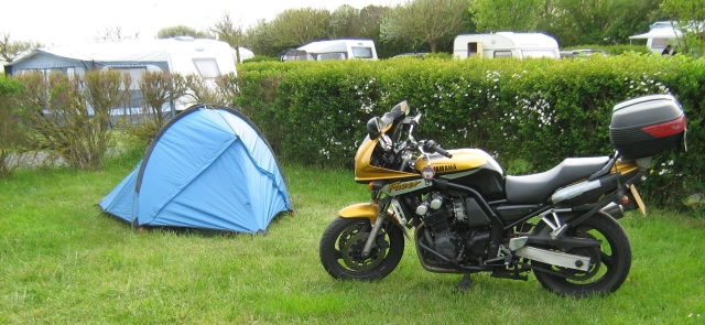 a small tent next to my motorcycle on the campsite at wimeraux france